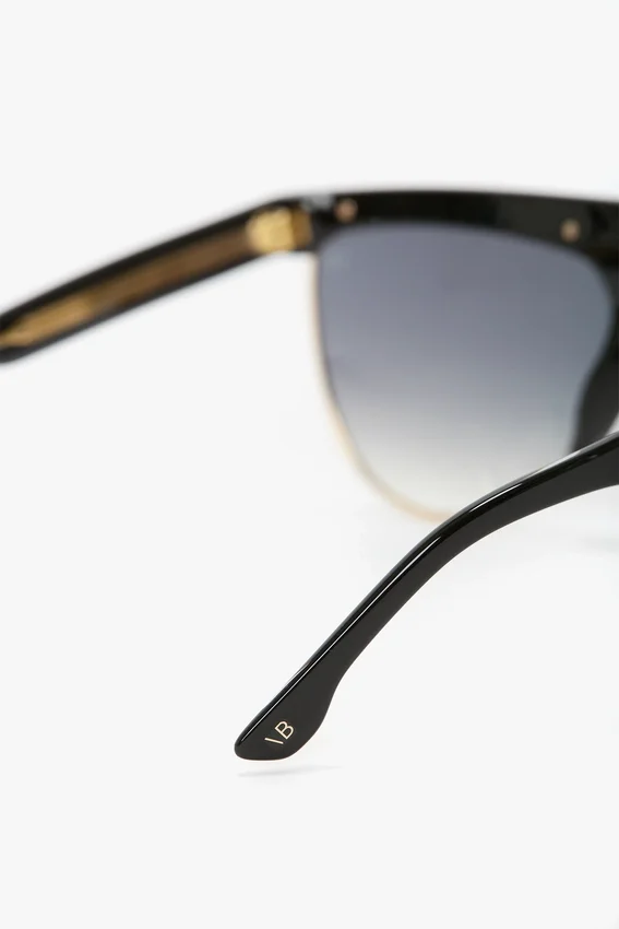 Geformte Sonnenbrille aus Metall und Acetat mit flachem Oberteil Geformte Sonnenbrille aus Metall und Acetat mit flachem Oberteil
