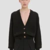 Strickjacke mit Zopfmuster und Taschen in Schwarz